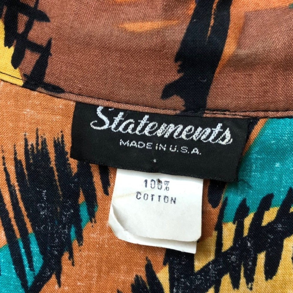 Statements clothing tag. Approximate date: 1990s.