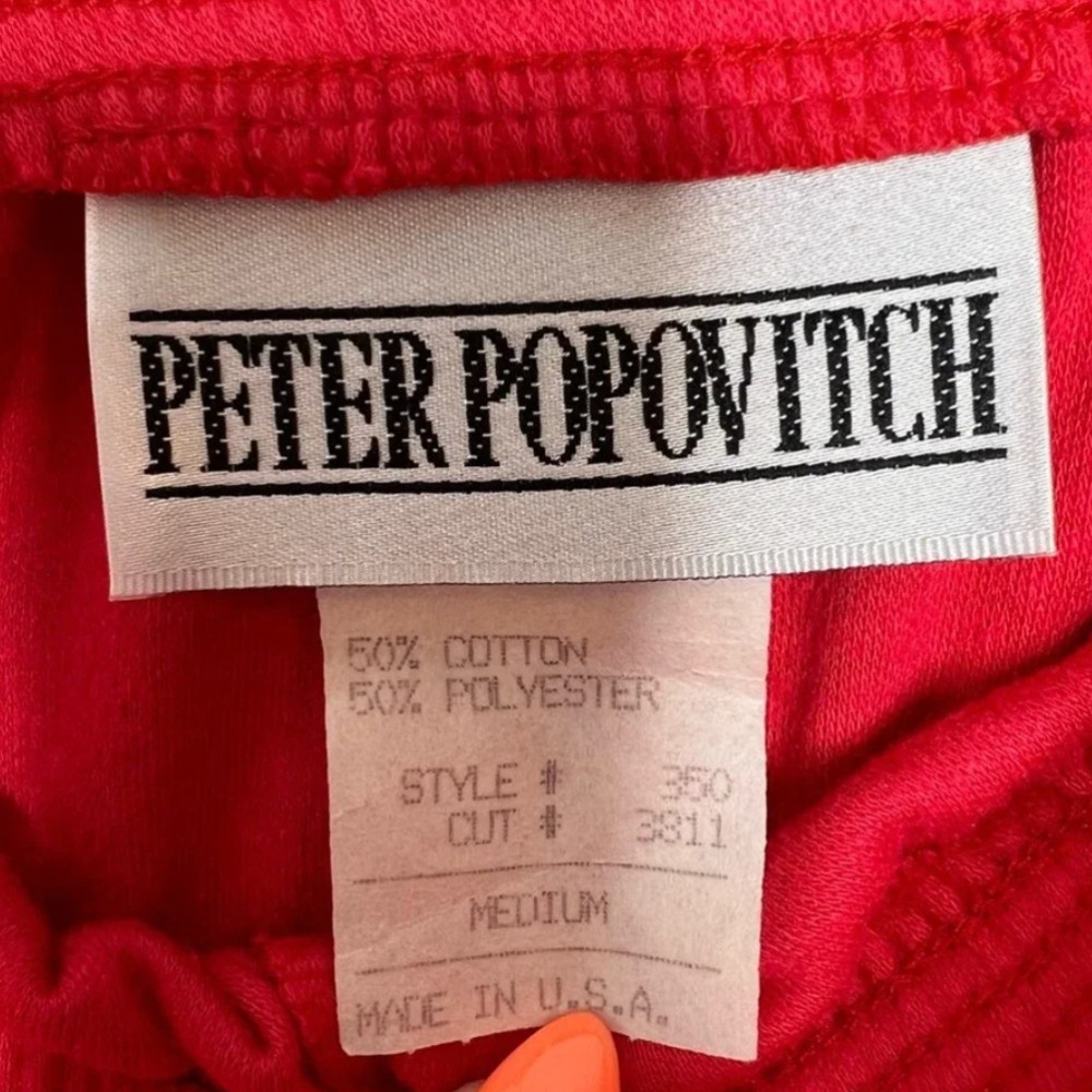 Peter Popovitch clothing tag. Approximate date: 1980s.