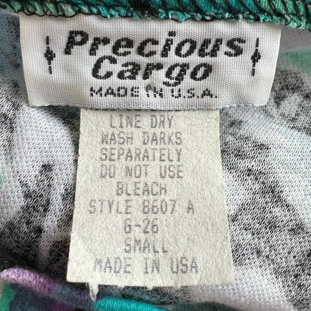 Precious Cargo clothing tag. Approximate date: 1990s. Recorded notes: Late 80s or early 90s.