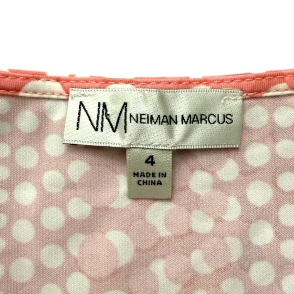 Neiman Marcus clothing tag. Approximate date: 2000s/Y2K. Recorded notes: NM Neiman Marcus